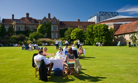 Festival goers picnic in the grounds of Glyndebourne Opera House